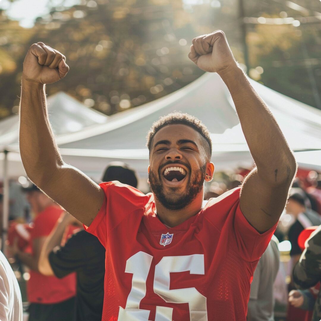 Man cheering at a football tailgate party